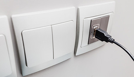 USB outlet installed next to other power points in a home